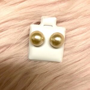 Selling cream colored earrings.